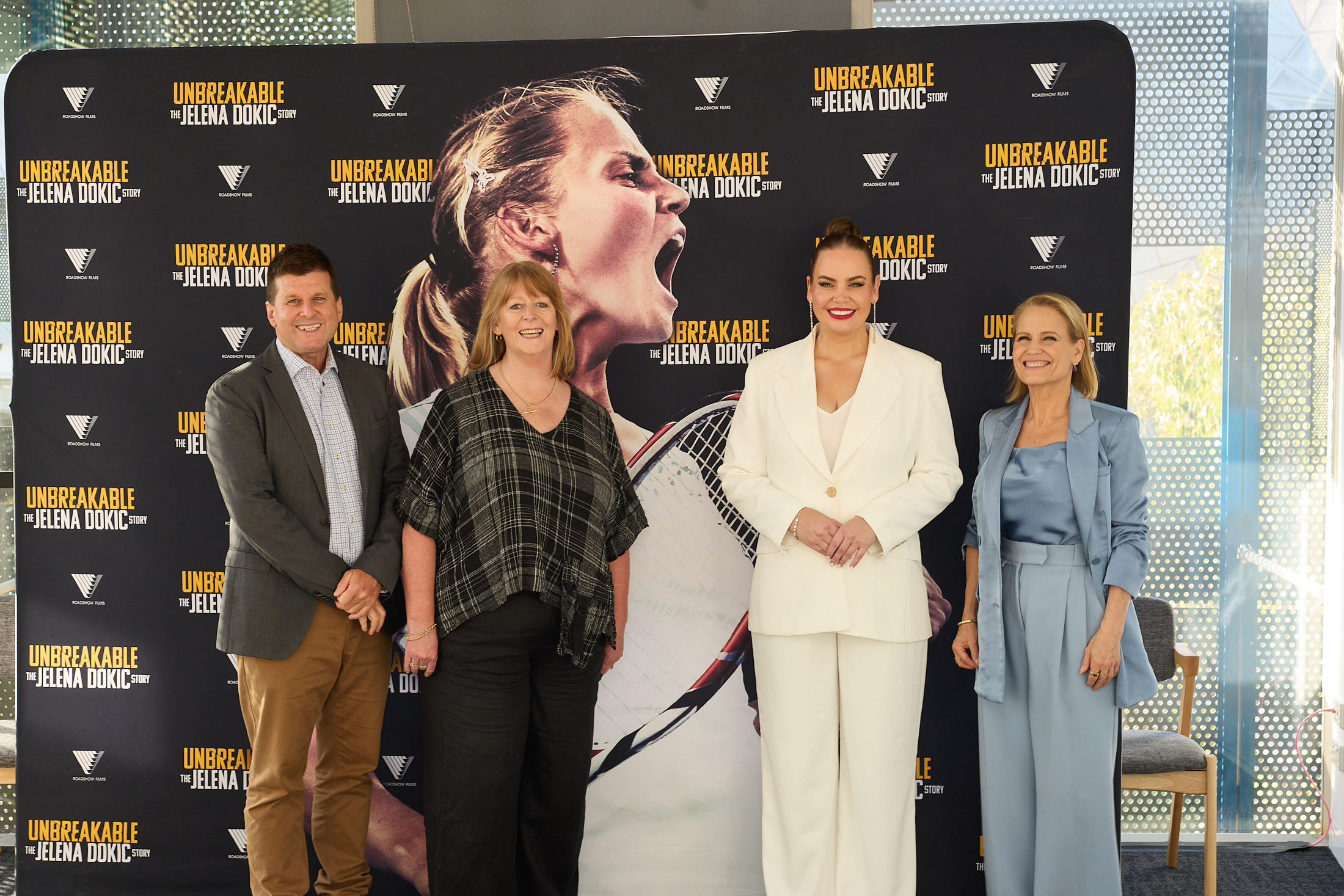 Dr Paul Oliver, Janise Mitchell, Jelena Dokic and Shaynna Blaze standing in front of a media wall.