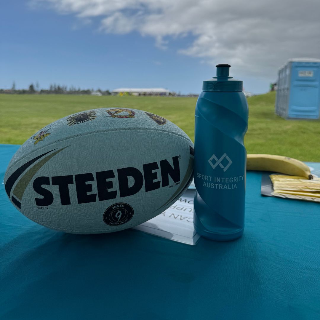 Football and Sport Integrity water bottle on a table