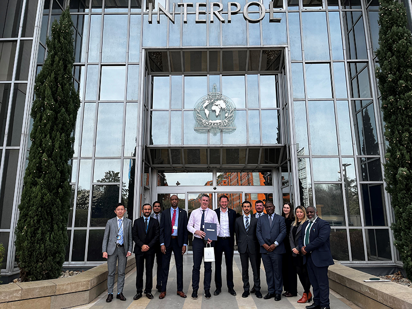 INTERPOL secondment group photo in front of INTERPOL's headquarters in France