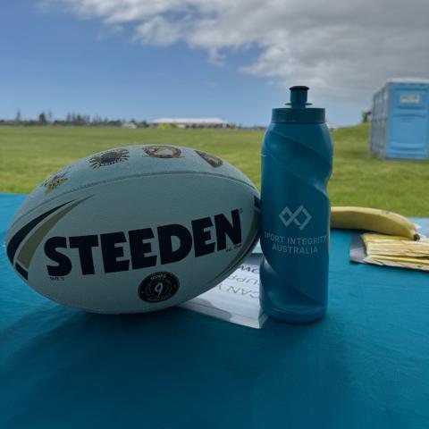 Football and Sport Integrity water bottle on a table