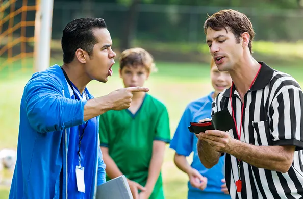 coach screaming at umpire