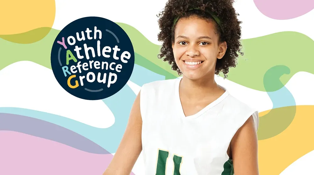 A youth athlete smiles for the Youth Athlete Reference Group (YARG)