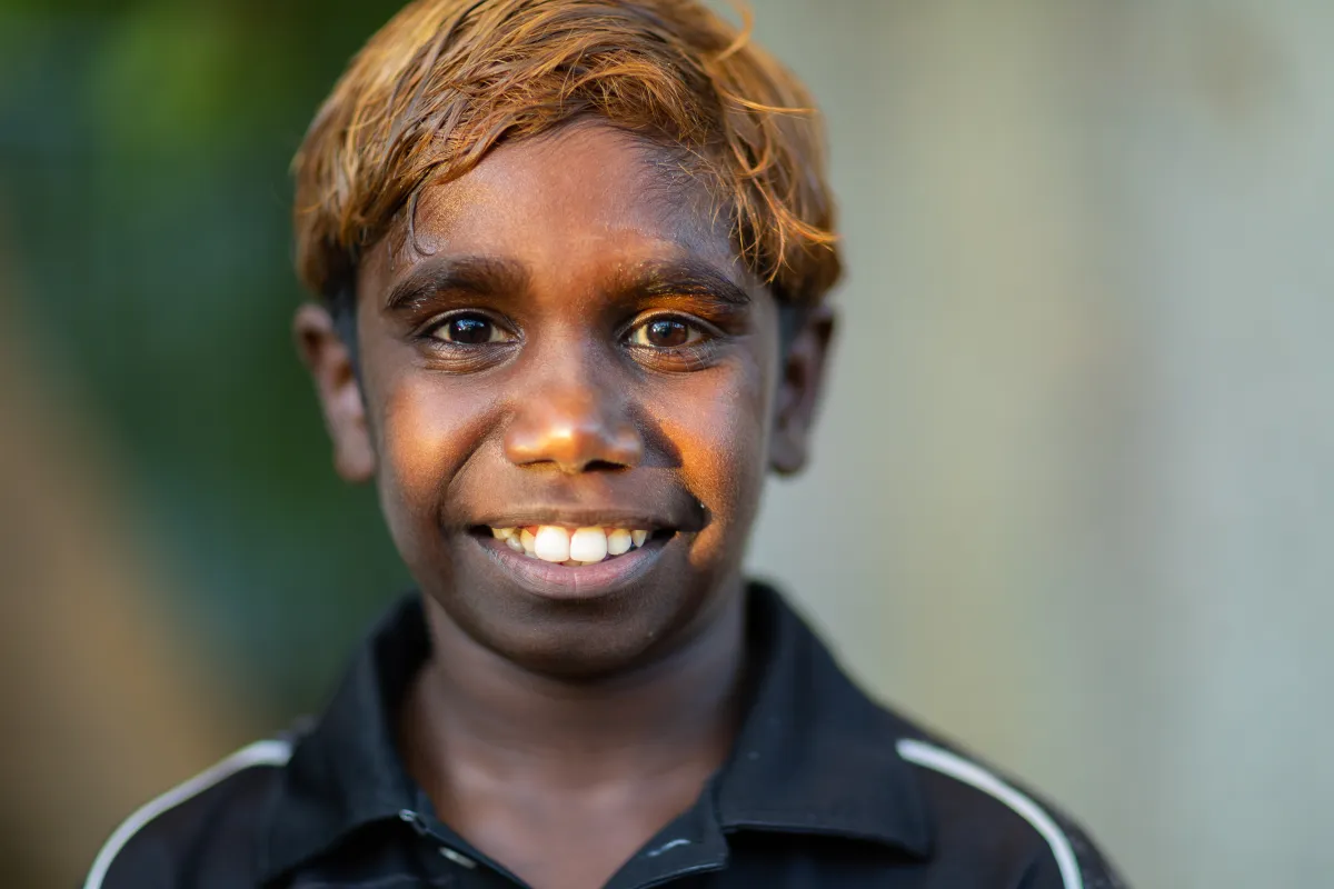 Indigenous Australian boy smiles