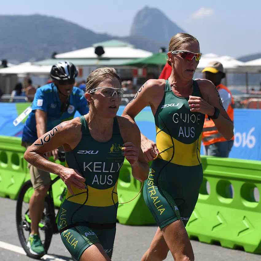 Katie Kelly and sighted guide Michelle Jones compete in the PT5 Triathlon at the 2016 Paralympic Games